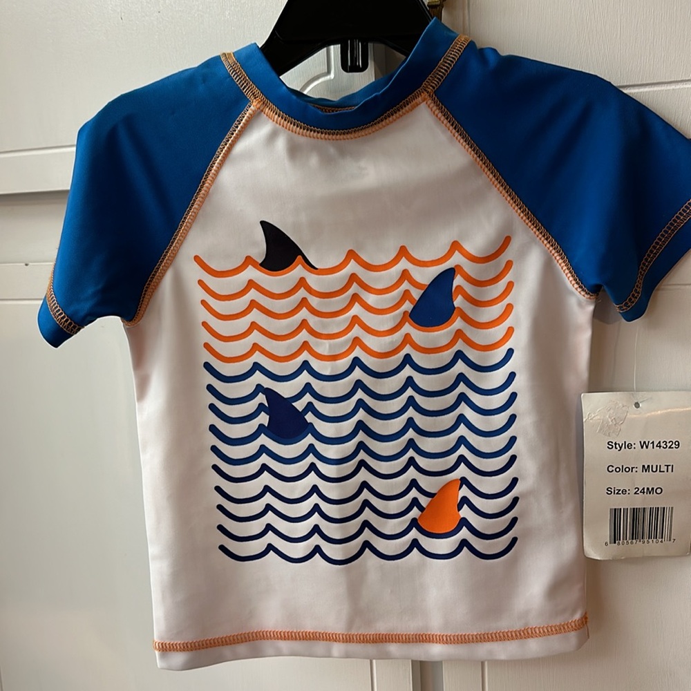 NWT FREESTYLE REVOLUTION SWIM SHIRT. Size 24mo. White w/blue & orange. Unisex.